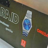 Omega Raid Cartello Vetrina Vintage